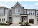 Charming two-story home with a gray siding, a garage, and beautifully landscaped front yard at 2003 Regal Dr # 90, Durham, NC 27703