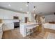 Open kitchen with a center island, pendant lights, and an open view to the living room at 2003 Regal Dr # 90, Durham, NC 27703