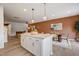 Kitchen island with seating and open views to the dining and living areas at 2003 Regal Dr # 90, Durham, NC 27703