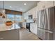 Modern kitchen with stainless steel appliances, white cabinetry, and a bright window view at 2003 Regal Dr # 90, Durham, NC 27703
