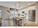 Bright kitchen features an island with seating, pendant lights, and stainless steel appliances at 2003 Regal Dr # 90, Durham, NC 27703