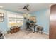 Bedroom with a desk, chair, and view of houses through the window at 2059 Dowell Ct, Burlington, NC 27215