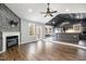 Open-concept living space with a fireplace, backyard access, and an island at 2120 Canterbury Rd, Clayton, NC 27520