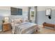 Charming bedroom featuring cozy decor, a comfortable bed, and light blue accent wall at 22 Black Creek Dr, Lillington, NC 27546