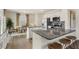 Modern kitchen with stainless steel appliances, granite countertops, and a breakfast bar with stools at 22 Black Creek Dr, Lillington, NC 27546