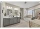 Spacious bathroom featuring dual sinks, a large tub, and a separate shower at 2233 Kanata Mills Rd, Wake Forest, NC 27587