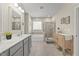 Bright bathroom featuring double vanity, soaking tub, and tiled shower at 2233 Kanata Mills Rd, Wake Forest, NC 27587