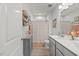 Bright bathroom with a shower/tub combo and gray vanity at 2233 Kanata Mills Rd, Wake Forest, NC 27587