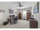 Bedroom features a large desk, bookshelf, and a ceiling fan at 2233 Kanata Mills Rd, Wake Forest, NC 27587