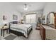 Cozy bedroom with a comfortable bed, decorative pillows, and natural light from the windows at 2233 Kanata Mills Rd, Wake Forest, NC 27587