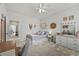 Bright bedroom featuring a comfortable bed, dresser, and tasteful decor at 2233 Kanata Mills Rd, Wake Forest, NC 27587