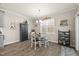 Cozy dining area with a round table, chairs, and natural light from the window at 2233 Kanata Mills Rd, Wake Forest, NC 27587