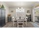 Bright dining space featuring a round table with chairs, and a sliding glass door to the deck at 2233 Kanata Mills Rd, Wake Forest, NC 27587