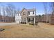 Inviting two-story home featuring mixed siding, well-manicured lawn, and attached two-car garage at 2233 Kanata Mills Rd, Wake Forest, NC 27587