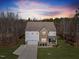 Beautiful two-story home featuring mixed siding, well-manicured lawn, and attached two-car garage at 2233 Kanata Mills Rd, Wake Forest, NC 27587