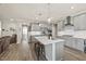 Bright kitchen with stainless appliances, bar stool seating, and open layout at 2233 Kanata Mills Rd, Wake Forest, NC 27587
