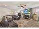 Inviting living room featuring a cozy fireplace and large sectional sofa for comfortable lounging at 2233 Kanata Mills Rd, Wake Forest, NC 27587