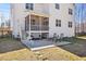 Inviting outdoor patio with seating and views of the lush backyard at 2233 Kanata Mills Rd, Wake Forest, NC 27587