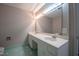 Spacious bathroom with a large mirror, double sinks, and updated lighting at 2404 Pearces Rd, Zebulon, NC 27597