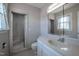 Clean bathroom featuring a tub and shower, a large mirror, and neutral tones at 2404 Pearces Rd, Zebulon, NC 27597