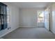 Bedroom with exterior access door and natural light at 2404 Pearces Rd, Zebulon, NC 27597