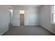 Bright bedroom with carpet floors and a large closet for ample storage space at 2404 Pearces Rd, Zebulon, NC 27597
