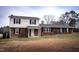 Charming two-story home with brick and vinyl siding and mature trees at 2404 Pearces Rd, Zebulon, NC 27597
