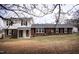 Two-story home with mixed brick and vinyl siding and manicured lawn at 2404 Pearces Rd, Zebulon, NC 27597
