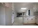 Open-concept kitchen showing cabinetry and seamless flow into living spaces at 2404 Pearces Rd, Zebulon, NC 27597