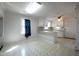 Spacious kitchen featuring bar counter, tile floor, and ample natural light at 2404 Pearces Rd, Zebulon, NC 27597