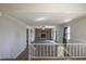 Comfortable living room featuring a stone fireplace and ample natural light at 2404 Pearces Rd, Zebulon, NC 27597