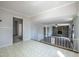 Bright open-concept living room with stone fireplace and large windows providing ample natural light at 2404 Pearces Rd, Zebulon, NC 27597