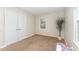 Spare bedroom with carpeted floor, natural light, and a closet at 2409 Keith Dr, Raleigh, NC 27610