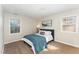 Cozy bedroom with a comfortable bed, carpeted floors, and natural light at 2409 Keith Dr, Raleigh, NC 27610
