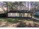 Charming single-story home with a brick facade, blue door, and covered front porch at 2409 Keith Dr, Raleigh, NC 27610