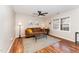 Inviting living room with hardwood floors, ceiling fan, and lots of natural light at 2409 Keith Dr, Raleigh, NC 27610