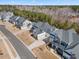 Aerial shot of a neighborhood featuring a home with a pool and manicured lawns at 2632 Jordan Pointe Blvd, New Hill, NC 27562
