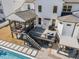 Aerial view showcases the well-designed backyard with a pool, deck, and pergola area at 2632 Jordan Pointe Blvd, New Hill, NC 27562