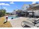 Backyard with a pool, patio with dining area and multiple seating areas for entertaining at 2632 Jordan Pointe Blvd, New Hill, NC 27562