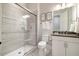Modern bathroom featuring a glass shower, gray tile, and neutral wall art for a spa-like retreat at 2632 Jordan Pointe Blvd, New Hill, NC 27562