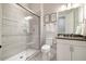 Modern bathroom featuring a glass-enclosed shower, a toilet, and a sleek vanity with sink at 2632 Jordan Pointe Blvd, New Hill, NC 27562