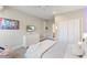Cozy bedroom featuring a swing chair, soft bedding, and stylish art for a relaxing ambiance at 2632 Jordan Pointe Blvd, New Hill, NC 27562