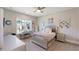 Cozy bedroom featuring a hanging chair, desk by the window and a stylish bed at 2632 Jordan Pointe Blvd, New Hill, NC 27562