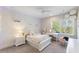 Charming bedroom with a white bed, vanity, and whimsical decor, bathed in natural light at 2632 Jordan Pointe Blvd, New Hill, NC 27562
