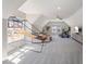 Spacious bonus room that features a basketball hoop, exercise equipment and comfortable seating area at 2632 Jordan Pointe Blvd, New Hill, NC 27562
