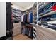 Well-organized walk-in closet provides plenty of storage with shelves, drawers, and hanging space at 2632 Jordan Pointe Blvd, New Hill, NC 27562