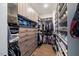 Spacious walk-in closet featuring ample shelving, drawers, and hanging space for organized storage at 2632 Jordan Pointe Blvd, New Hill, NC 27562