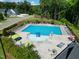 Aerial view of the community pool with seating and landscaping around the area at 2632 Jordan Pointe Blvd, New Hill, NC 27562