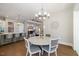 Dining area featuring chandelier and access to the kitchen and living spaces at 2632 Jordan Pointe Blvd, New Hill, NC 27562