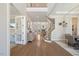 Spacious foyer with hardwood floors, staircase, and french doors creating an inviting entryway at 2632 Jordan Pointe Blvd, New Hill, NC 27562